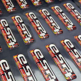 in tem nhựa phủ keo trong nổi 3D cho nút bấm, logo